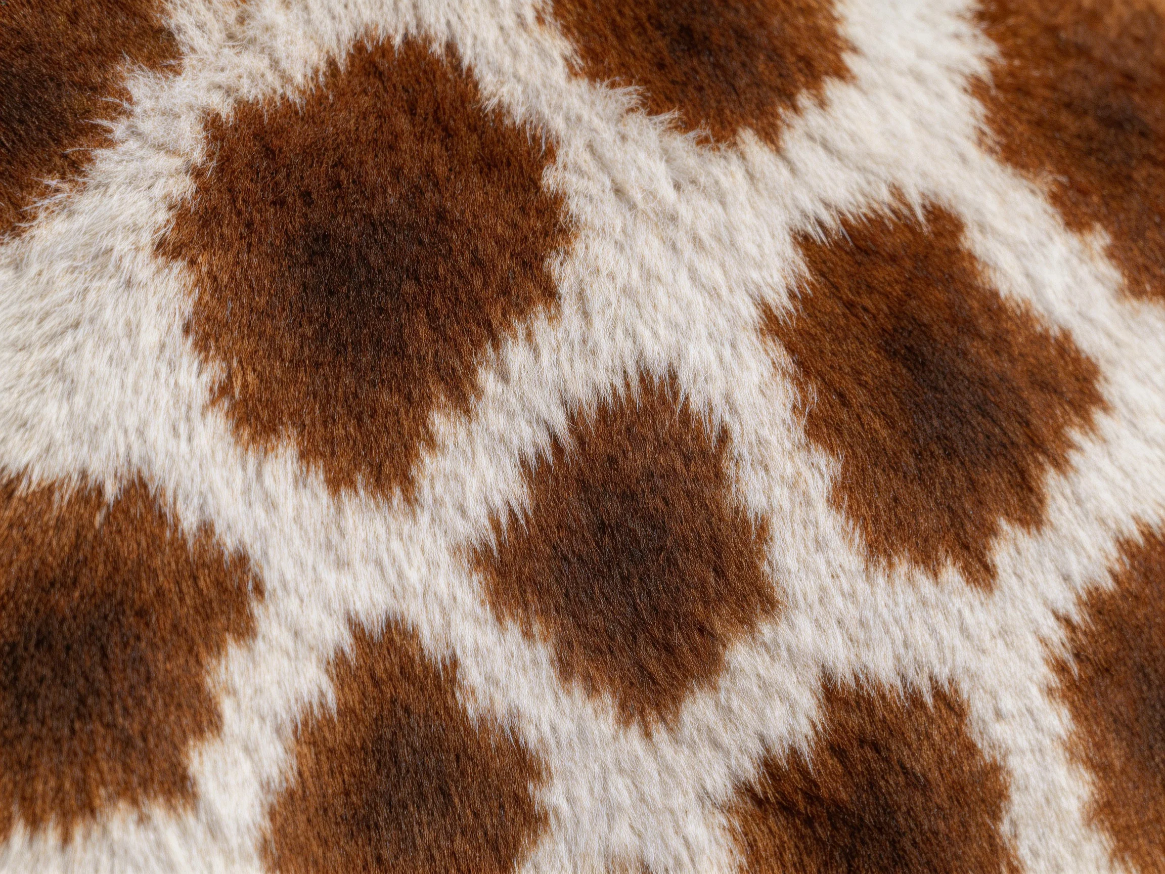 Brown spotted fabric close-up with white spaces between patterns