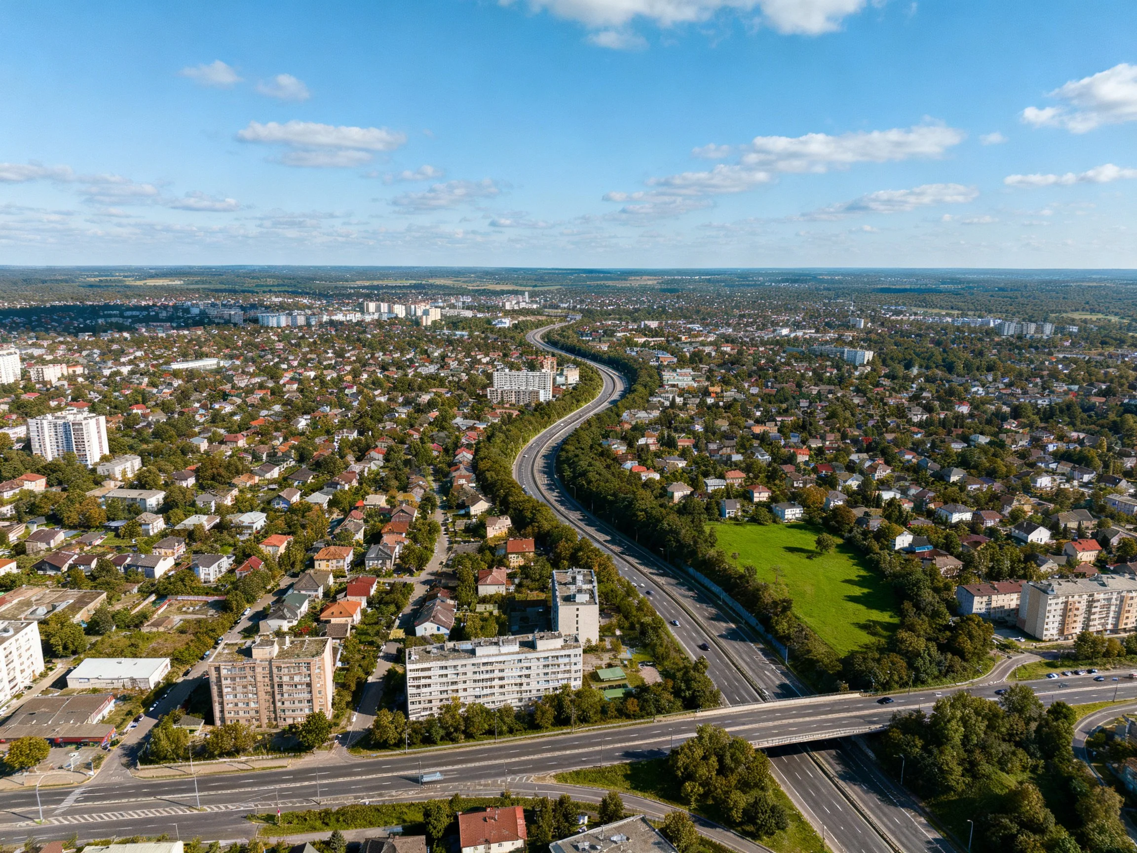 Aerial View of Urban Landscape with Curving Freeway