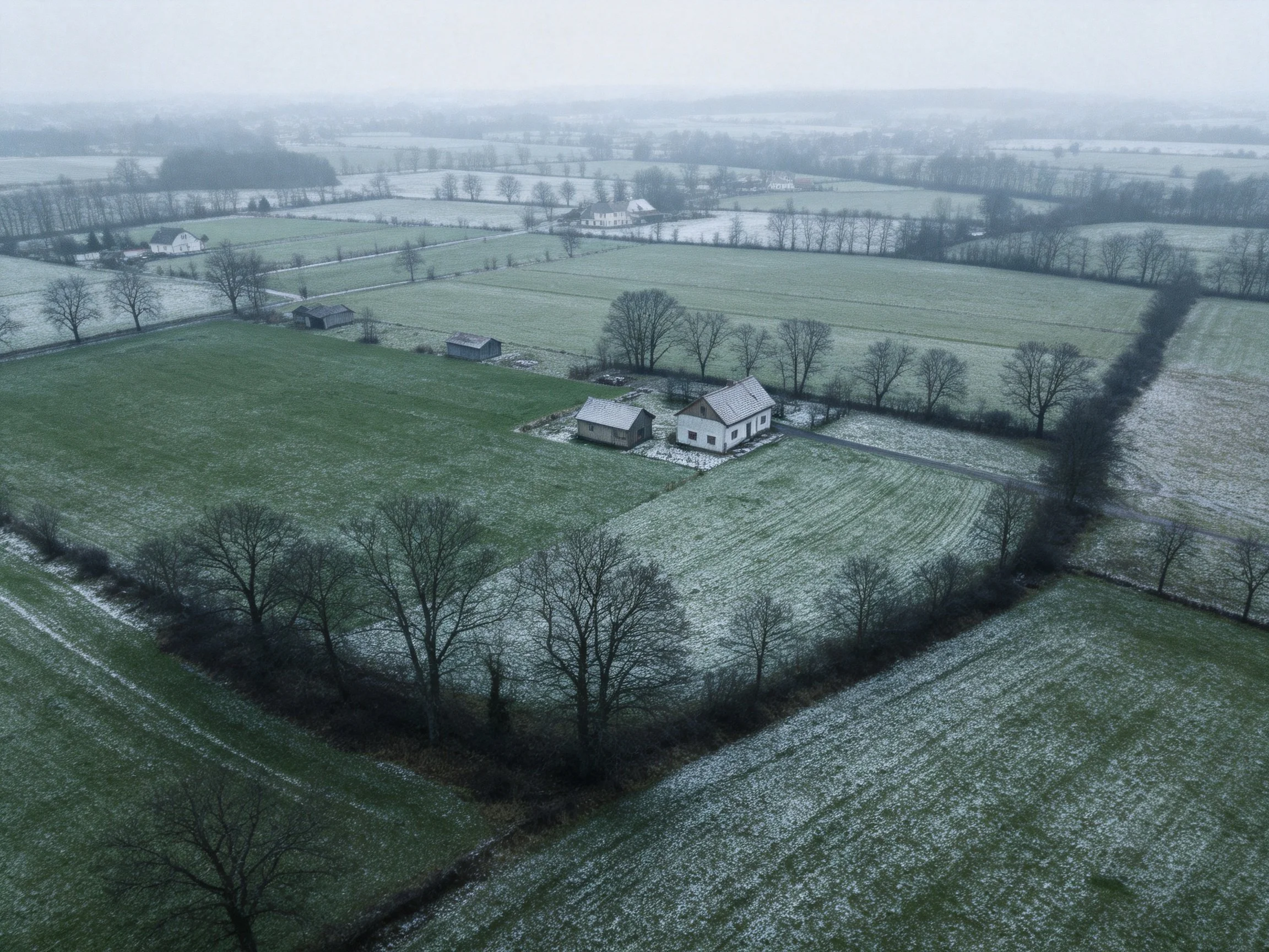 Aerial Winter Landscape with Farmhouse