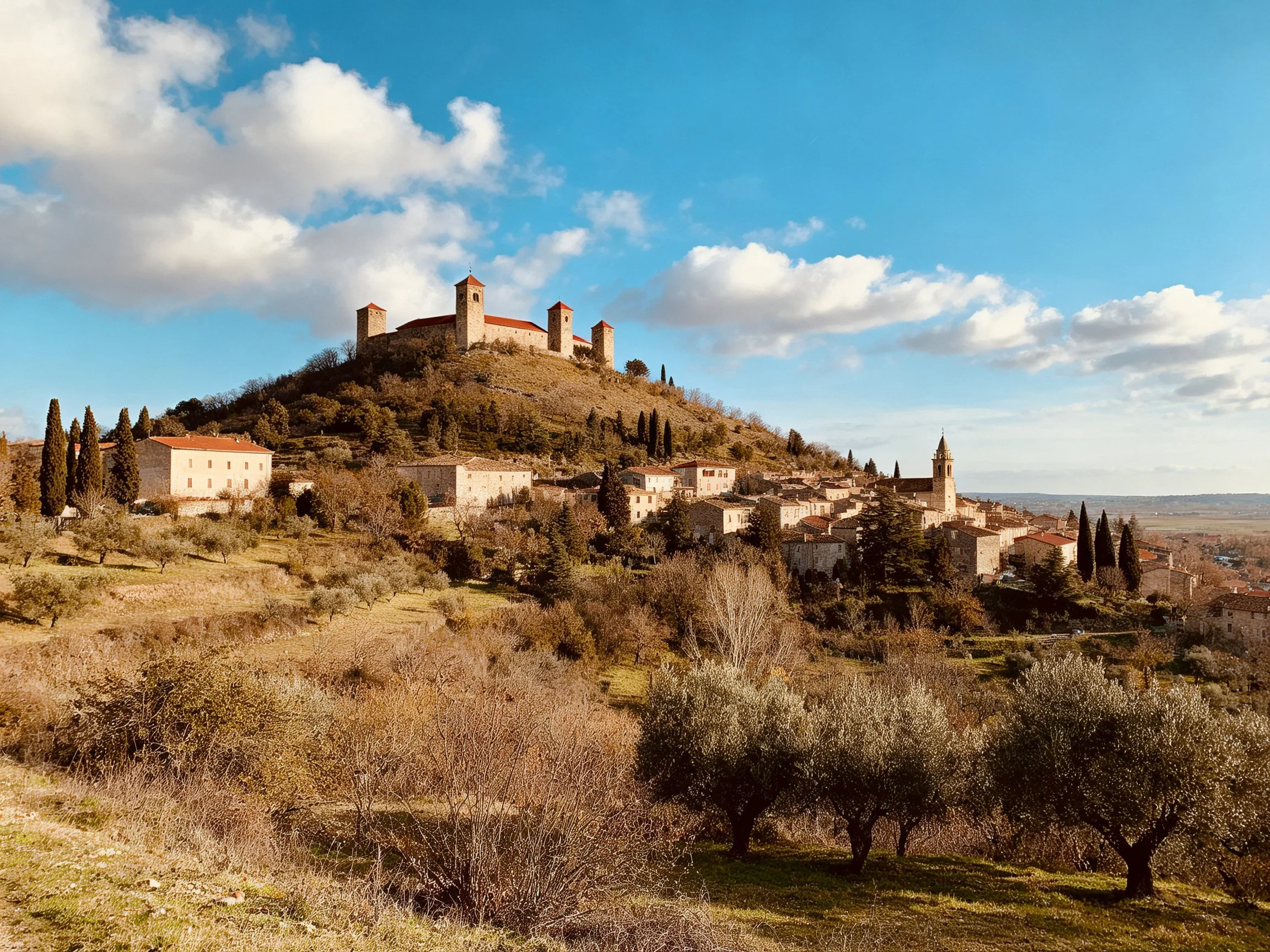 Ancient hilltop fortress overlooks charming stone village