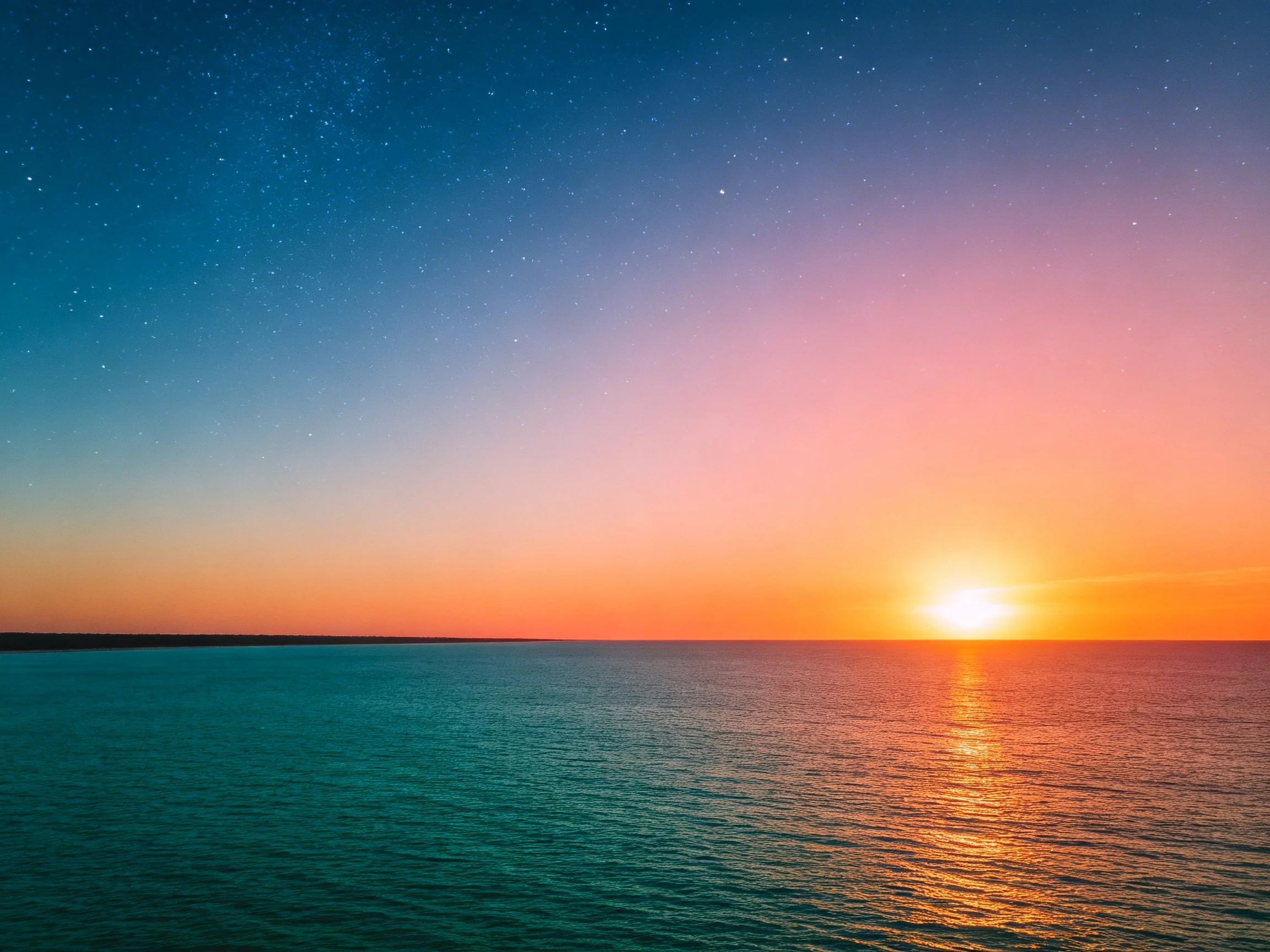 Calm ocean sunset with vibrant twilight sky