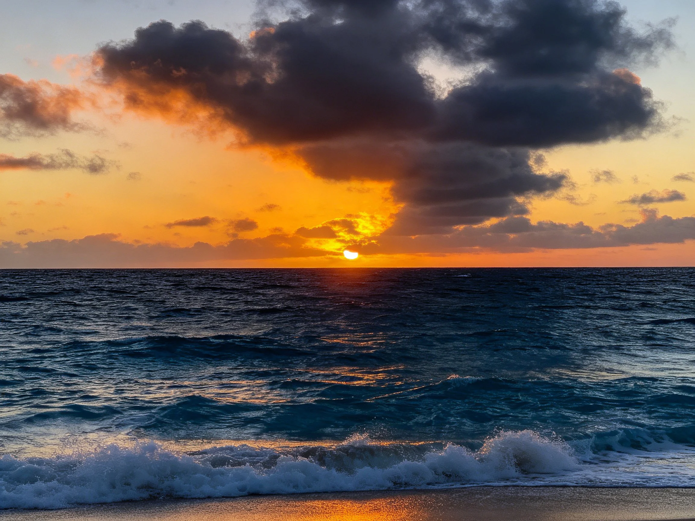 Dramatic Sunset Over Deep Blue Ocean With Dark Clouds