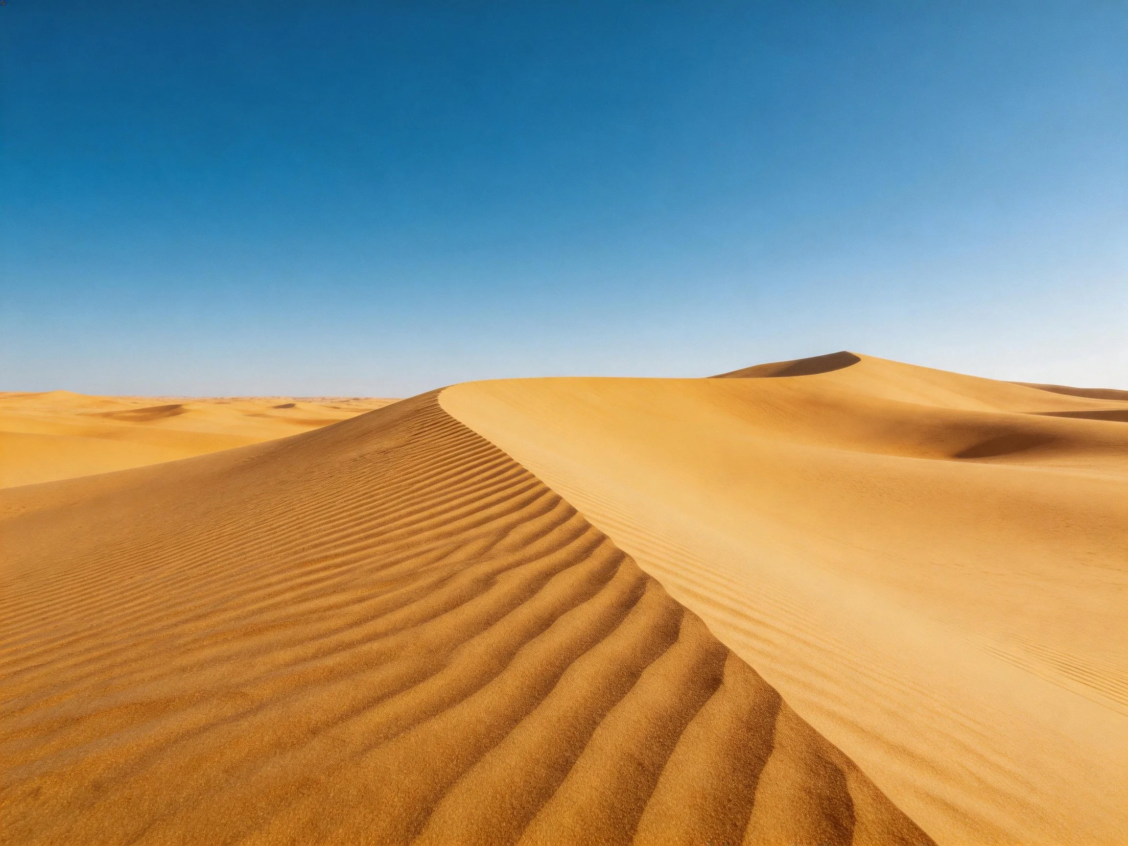 Golden Sand Dunes Under Clear Blue Sky