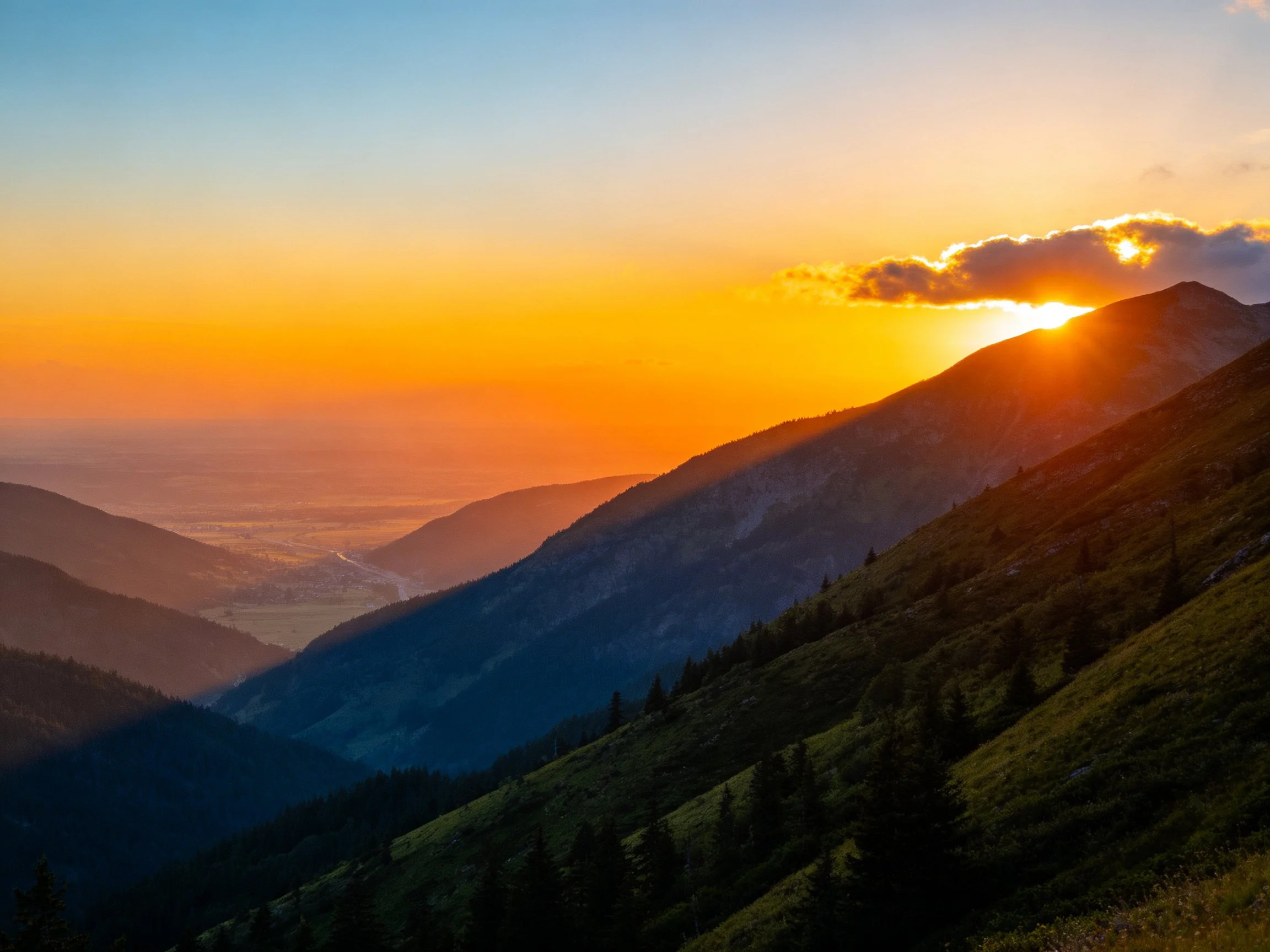 Golden Sunset Illuminates Rolling Mountain Terrain
