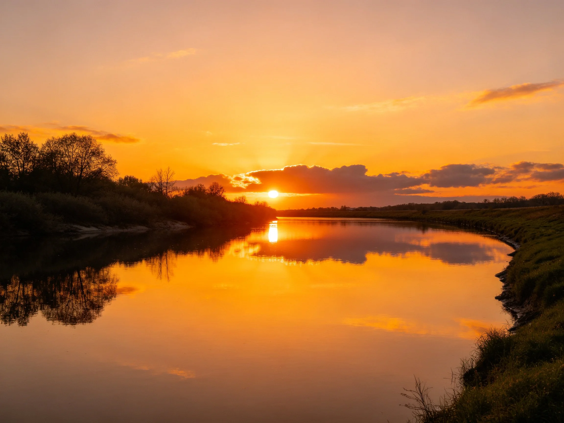 Golden sunset reflecting in tranquil river waters
