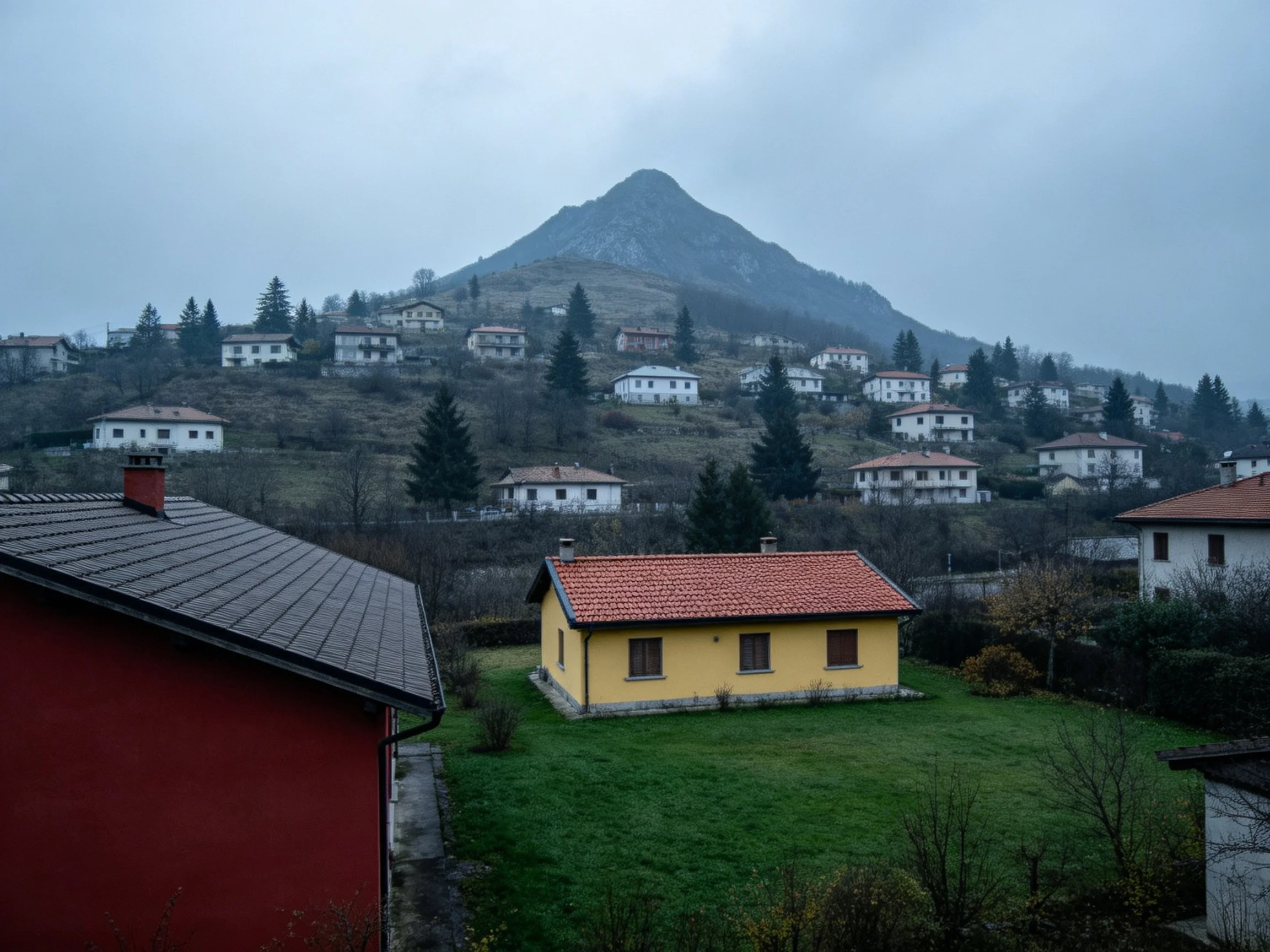 Hillside Village with Colorful Homes and Gray Mountain