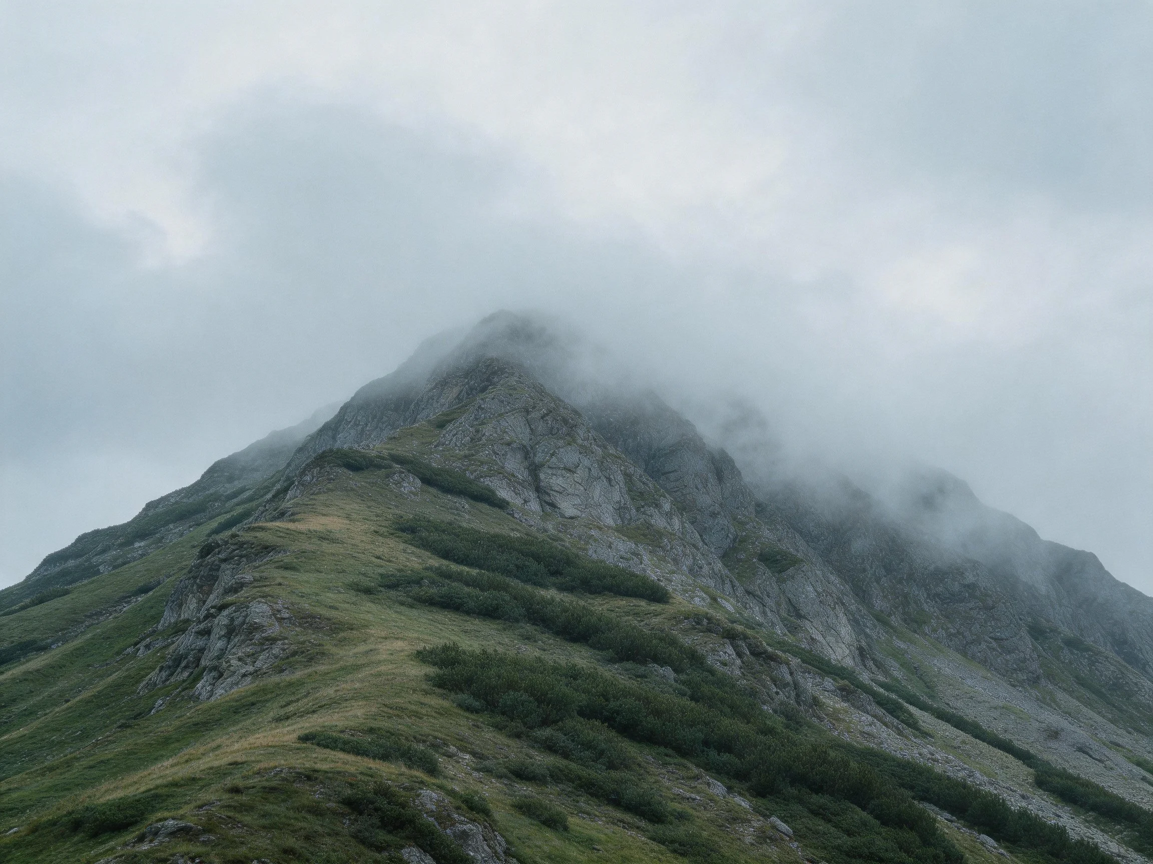 Misty Mountain Peak with Verdant Slopes