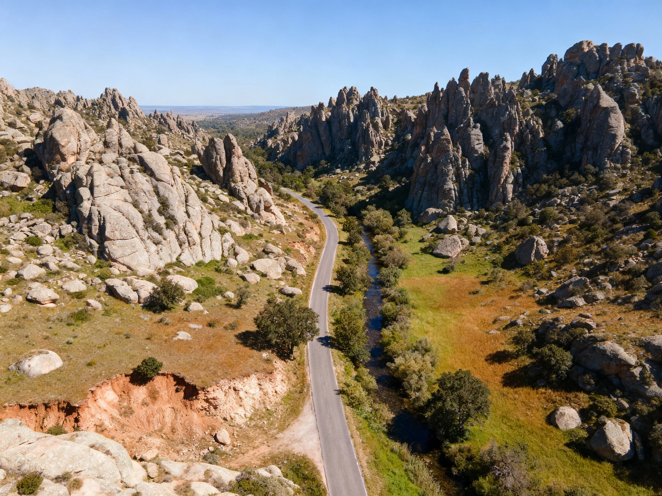 Rocky Canyon Landscape with Winding Road and Stone Formations