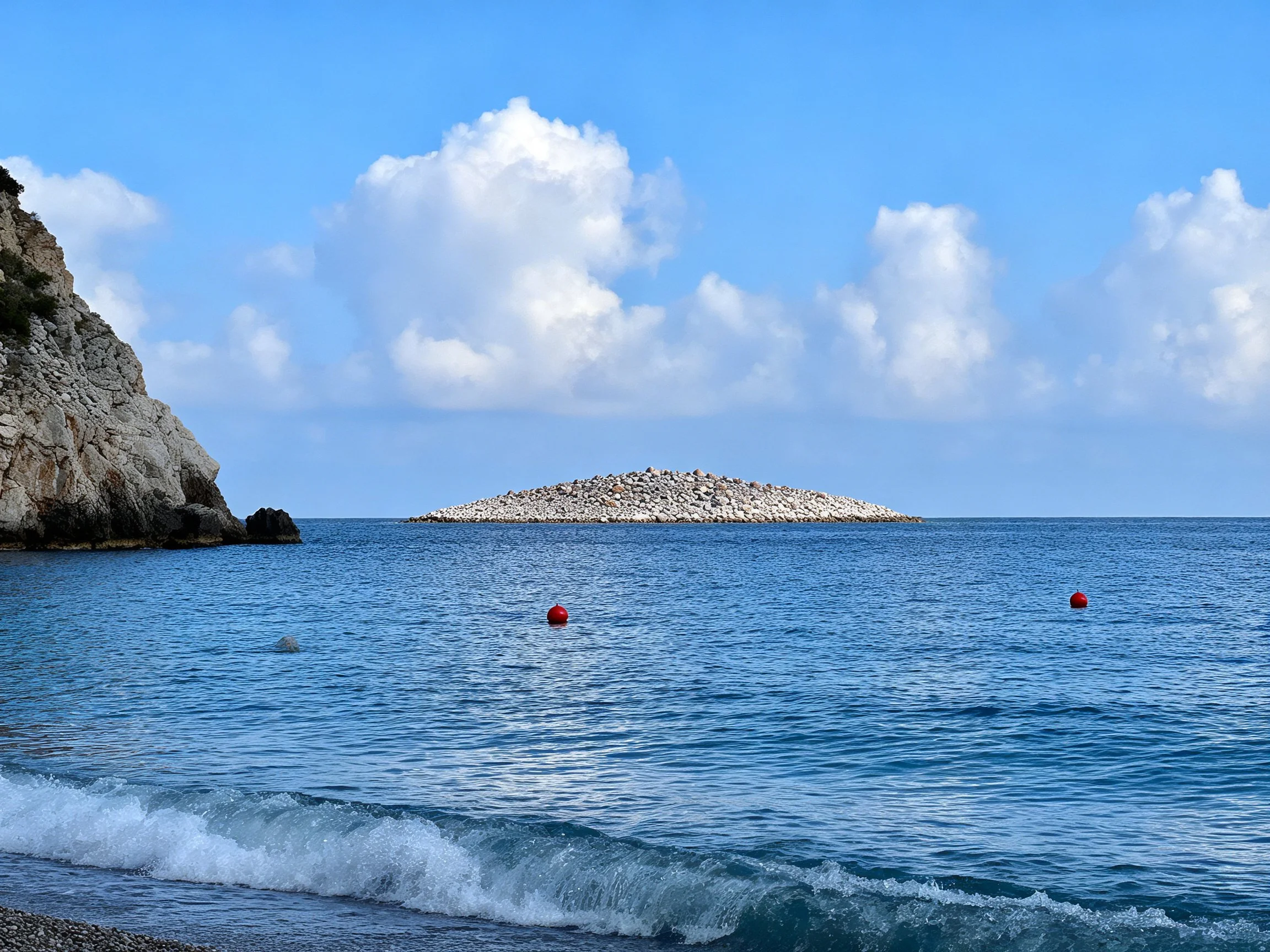 Rocky Coastal Scene with Blue Waters and Stone Island