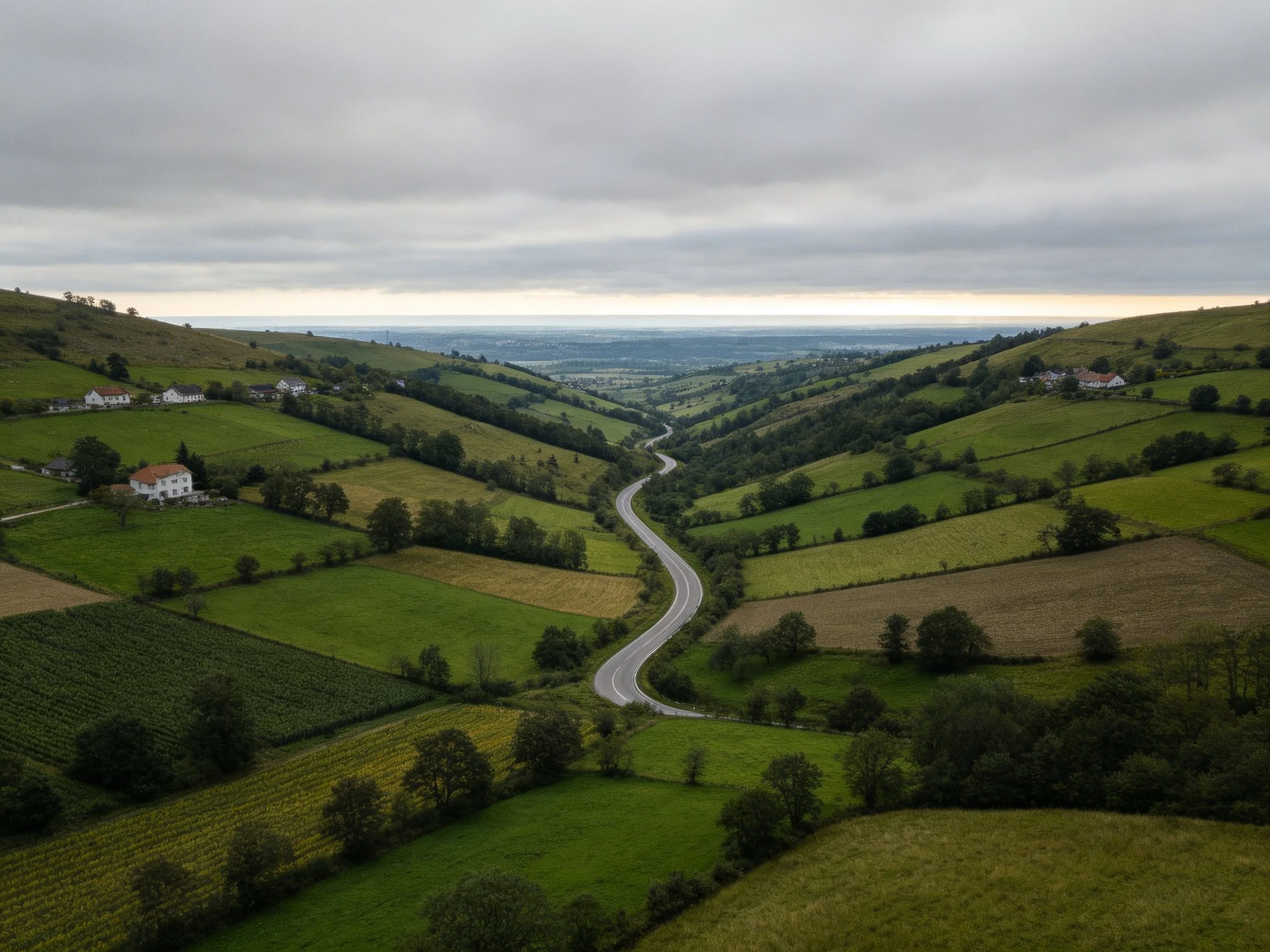 Rolling Green Hills with Winding Road and Scattered Farmhouses