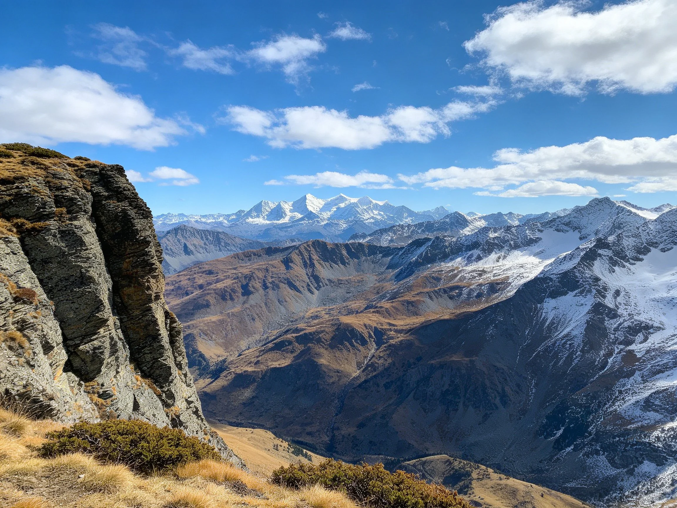 Rugged Mountain Scenery with Snow-Capped Peaks and Valleys