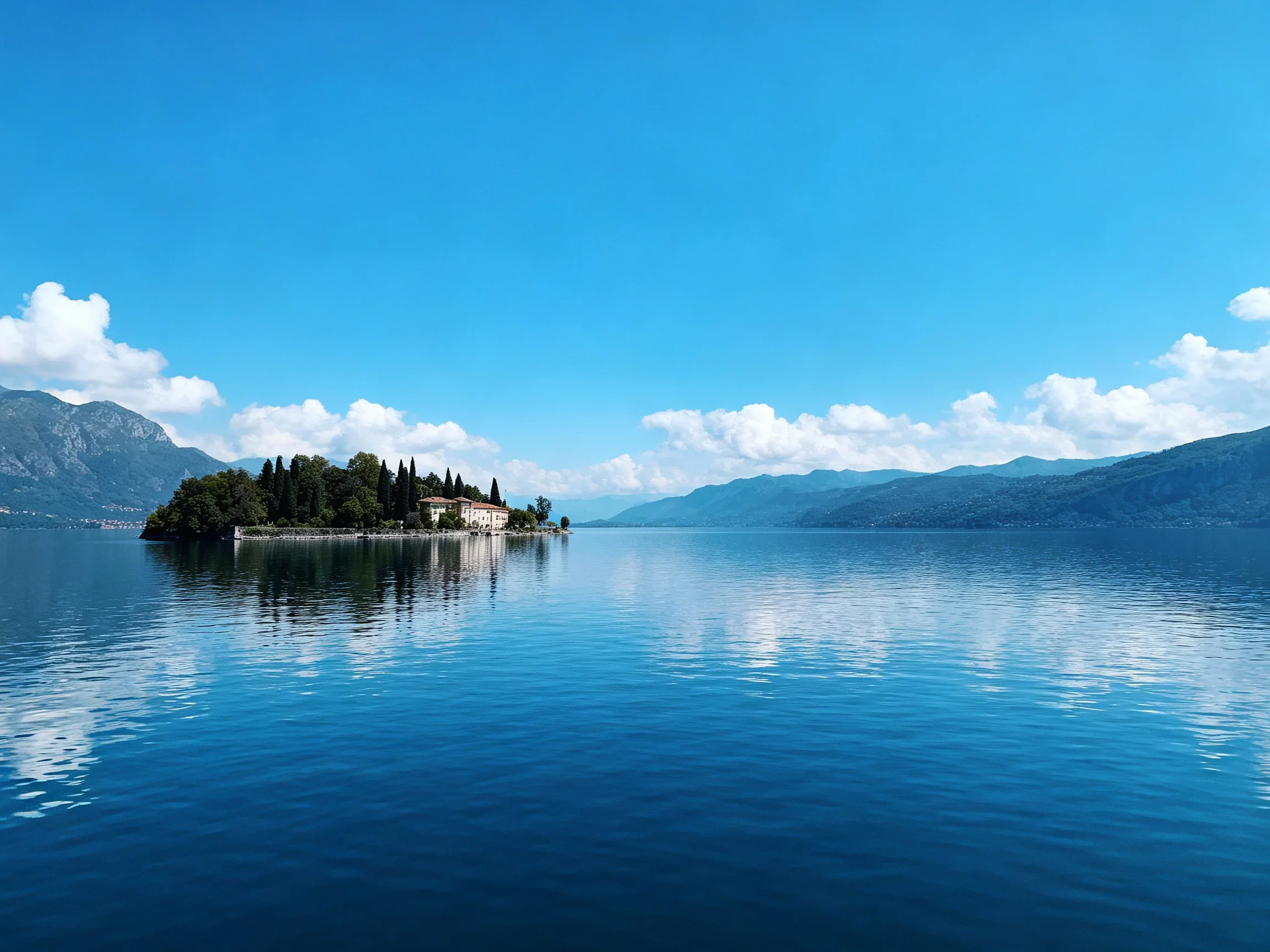 Serene Island With Buildings, Trees, and Calm Blue Waters