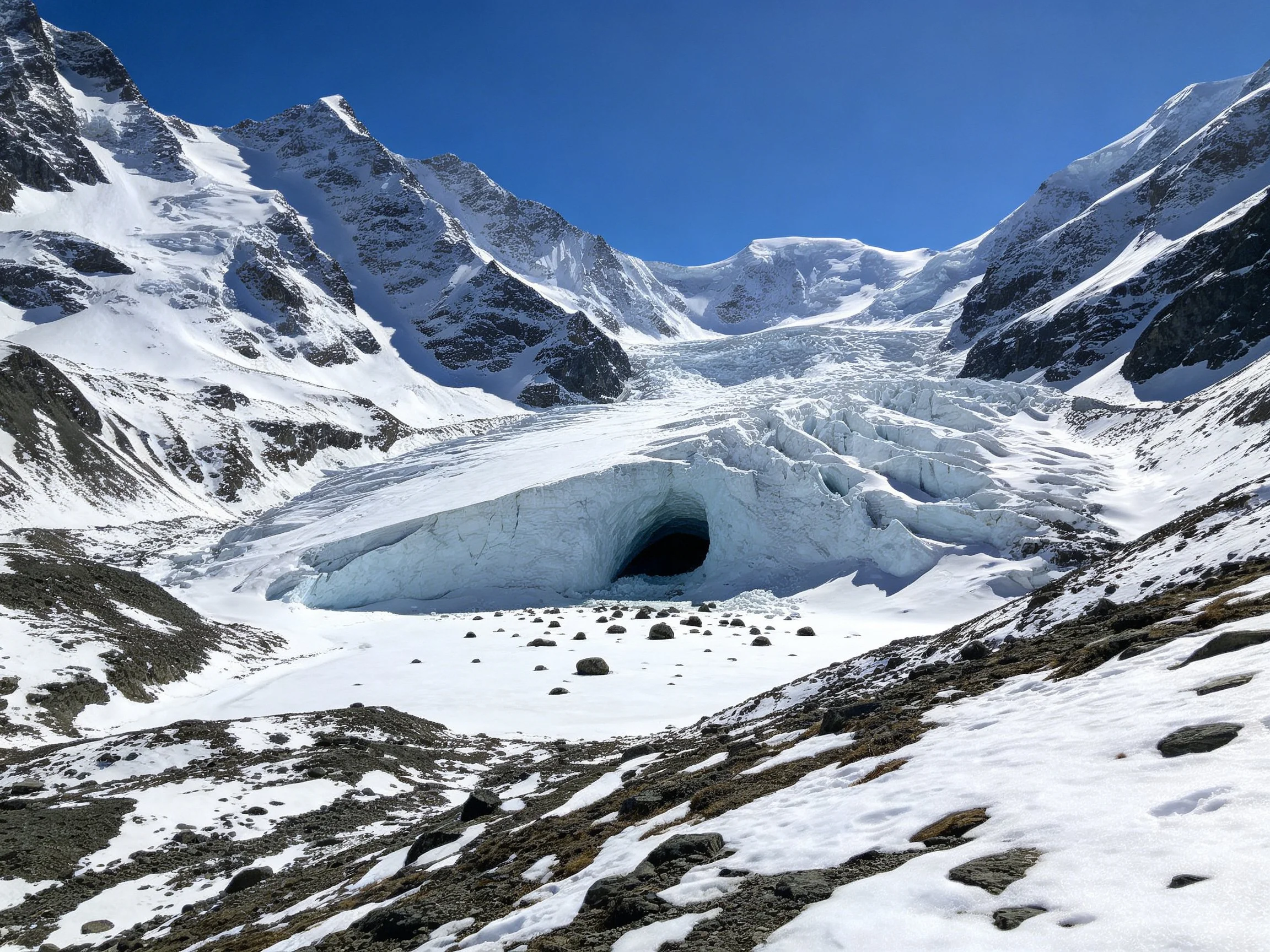 Snow-Capped Peaks Surrounding a Glacier with Ice Cave