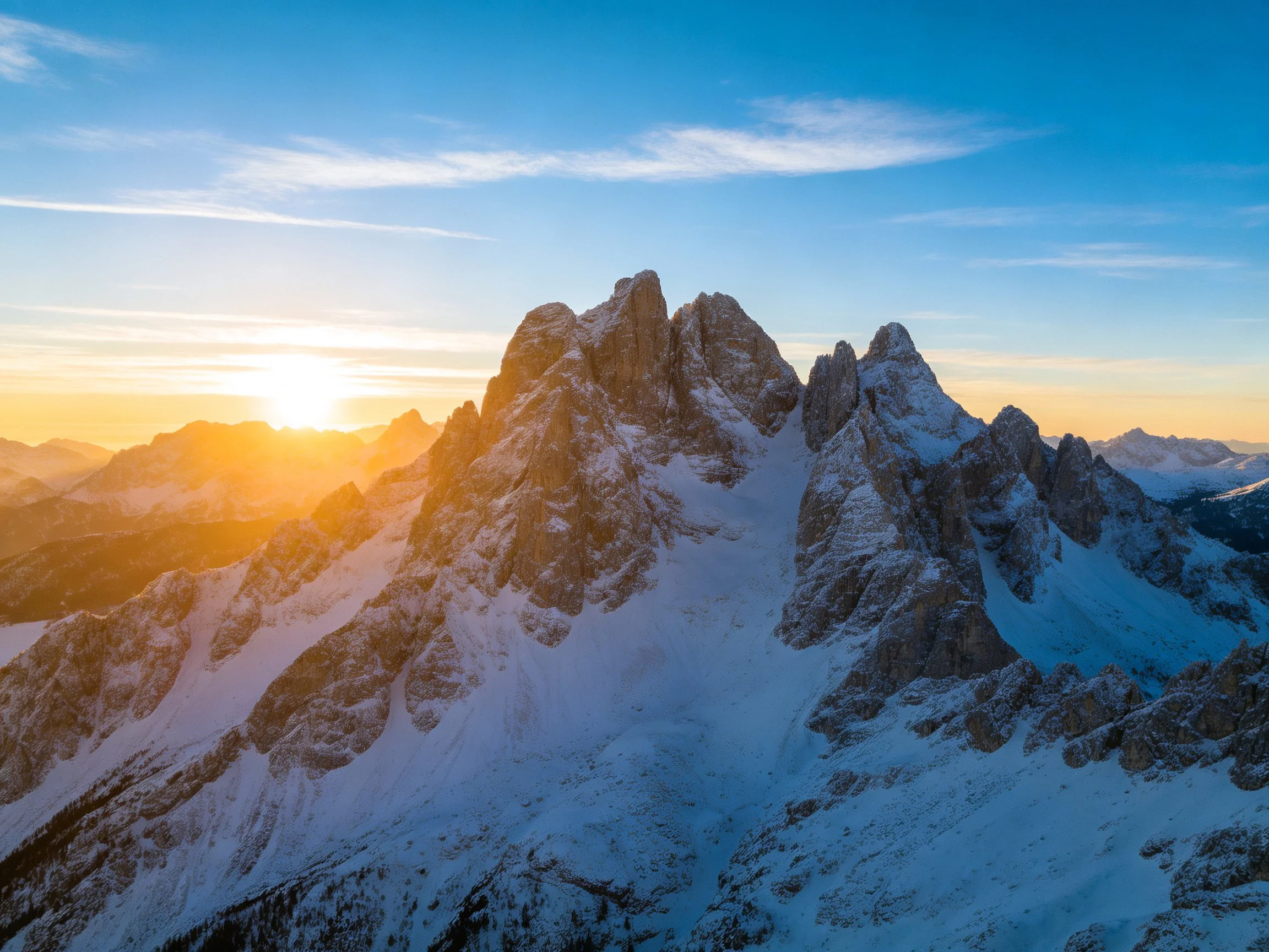 Snow-Covered Alpine Peaks at Dawn