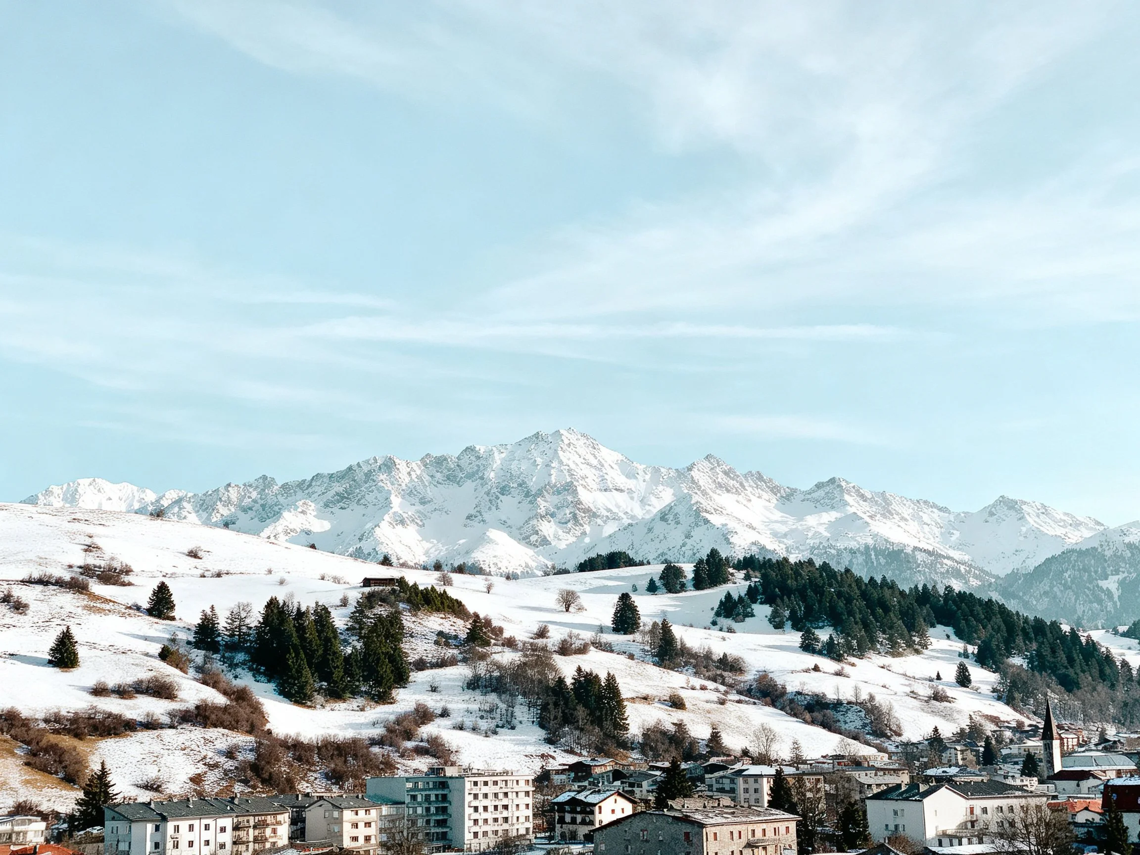 Snow-capped Peaks Over a Winter Alpine Town