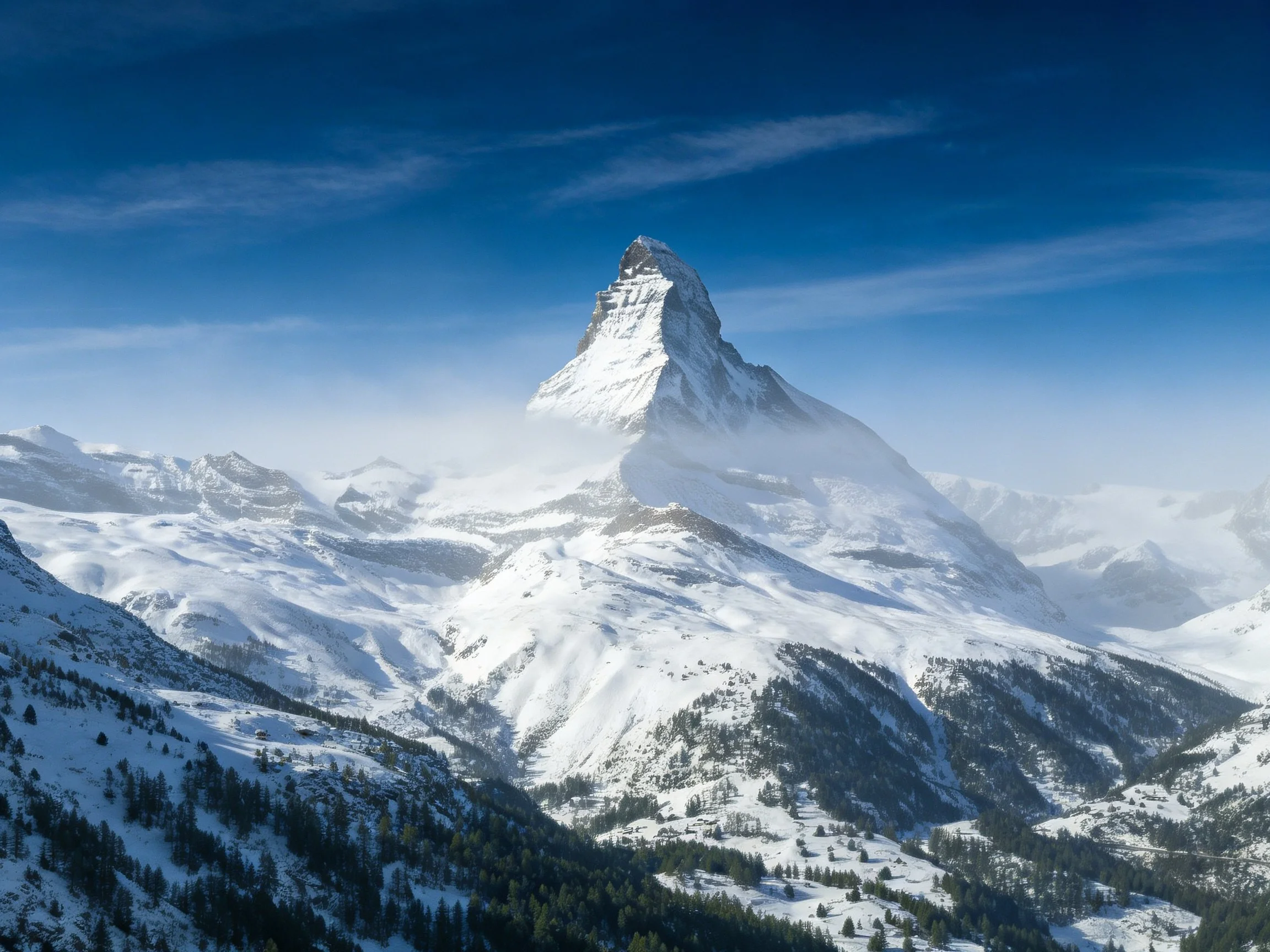 Snow-capped mountain peak under clear blue sky