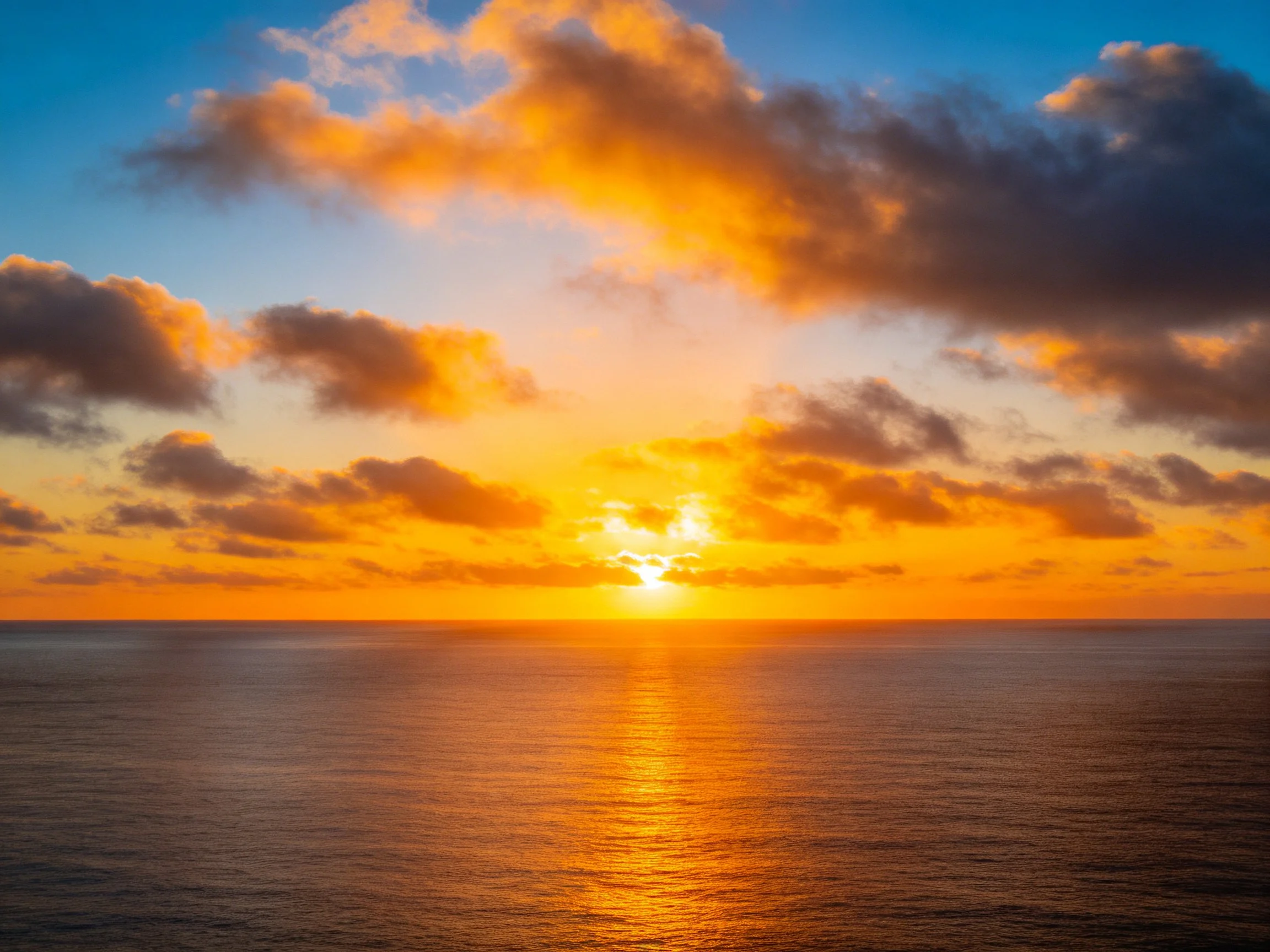 Vibrant Sunset Over Calm Ocean With Golden Clouds