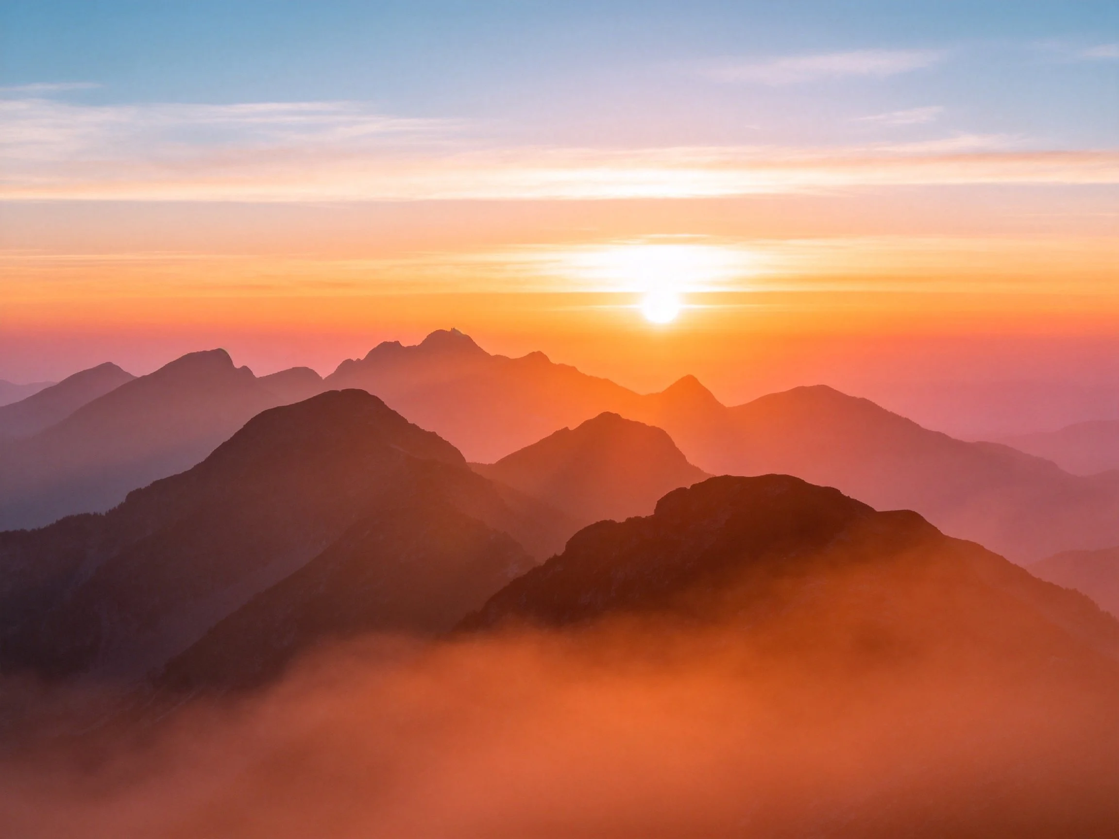 Vibrant Sunset Over Layered Mountain Peaks