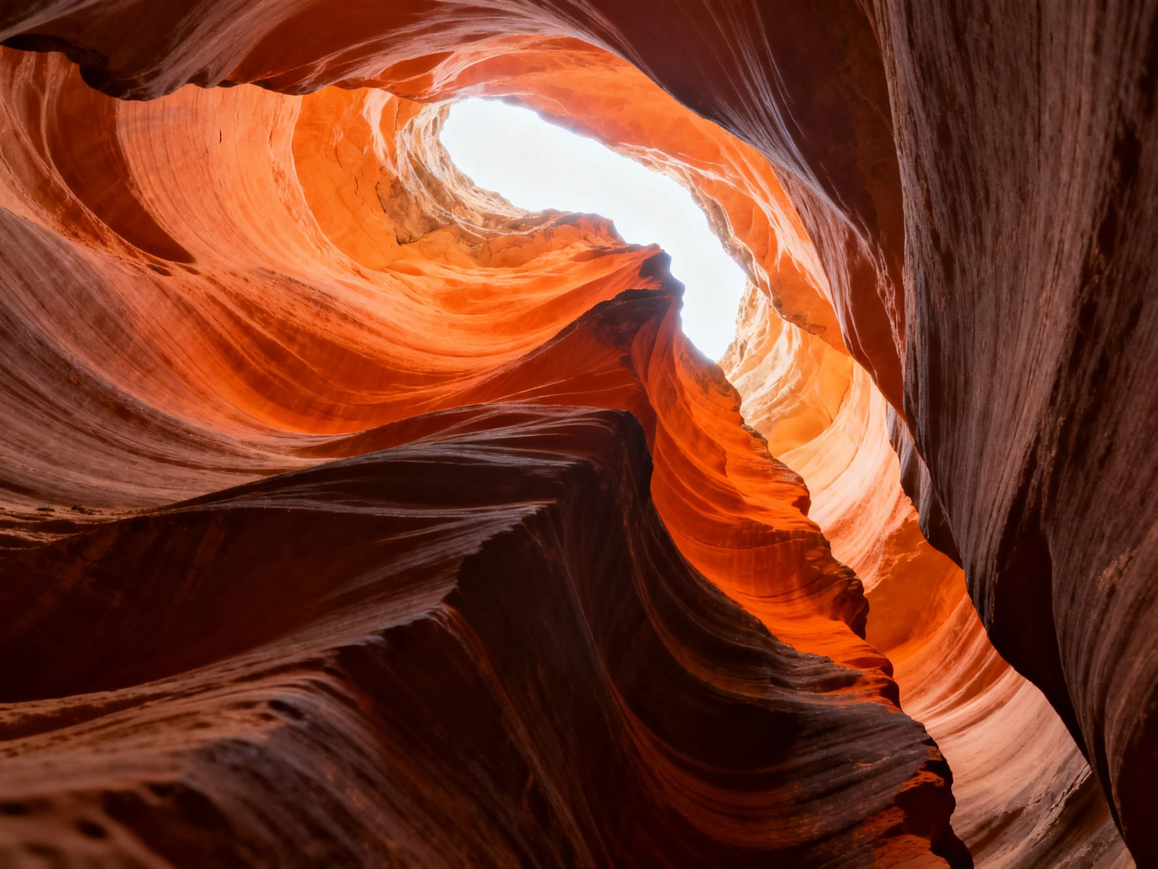 Vibrant orange and brown rock formations in a narrow canyon